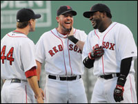Red Sox sluggers Jason Bay, Sean Casey and David Ortiz share a light moment before a game against the Texas Rangers.