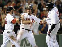 Red Sox slugger Kevin Youkilis gets congratulated by Dustin Pedroia and David Ortiz after his three-run homer in the eighth inning against the Texas Rangers.