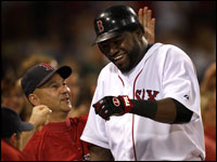 A smiling David Ortiz gets ribbed by teammates and Red Sox manager Terry Francona as he returns to the dugout.