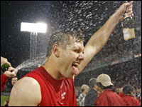 Jonathan Papelbon gets a champagne bath from teammate Jon Lester (left, not pitcured).