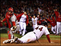 Red Sox outfielder Jason Bay slides past the tag of Angels catcher Mike Napoli for the winning run in Game 4 of the ALDS at Fenway.