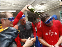 Red Sox players celebrate in the clubhouse after winning the ALDS at Fenway.