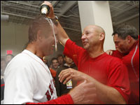 Red Sox manager Terry Francona (right) pours champagne over the head of pitching coach John Farrell after Game 4 of the ALDS.