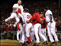 Sox first baseman Kevin Youkilis gets sky-high as the celebration begins after Game 4 of the ALDS at Fenway.