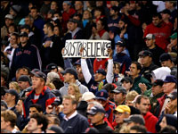 Red Sox fans arise in the eighth inning of Game 5 of the ALCS. The Red Sox came back from a 7-0 deficit in the late innings to win Game 5. (Barry Chin/Globe Staff)