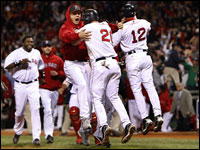 Red Sox closer Jonathan Papelbon leaps into the arms of Kevin Youkilis after Youkilis scored the winning run in Game 5 of the ALCS. The Red Sox came back from a 7-0 deficit in the late innings to win Game 5. (Barry Chin/Globe Staff)