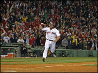 Red Sox first baseman Kevin Youkilis scores the winning run in Game 5 of the ALCS. The Red Sox came back from a 7-0 deficit in the late innings to win Game 5. (Jim Davis/Globe Staff)