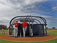   Red Sox outfielder J.D. Drew (7) and hitting coach Dave Magadan chatted behind a batting cage during a workout in Fort Myers. (Jim Davis/Globe Staff)