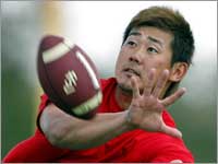 Pitcher Daisuke Matsuzaka caught a few passes from pitching coach John Farrell. (Jim Davis/Globe Staff)