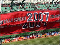 The 2007 World Series championship banner was unfurled over the 2004 title banner on the Green Monster at the Red Sox' home opener.