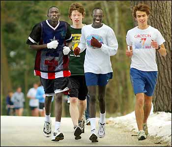 Gabriel Bol Akau runs with friends.