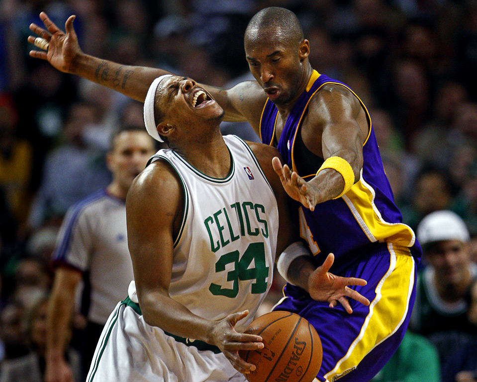 Boston Celtics captain Paul Pierce loses the ball while guarded by the Los 