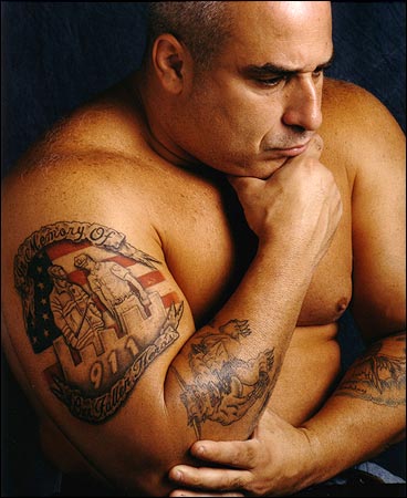 Police officer Mathew Spoto. His tattoo reads, "In memory of our fallen 
