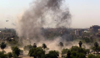 US helicopters flew over the site of a car bomb that exploded in a parking lot near the Green Zone in central Baghdad yesterday. In all, two car bombs in the capital killed at least 24 people.
