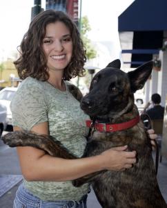 Shari Gonzalez poses with Loki, a dog she rents from Flex Petz in San Diego. Flex Petz rents dogs by the day to time-pressed and space-challenged people.