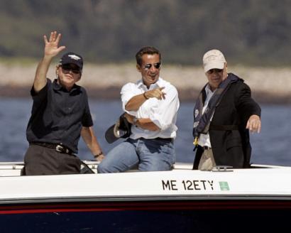 President Bush (left) and his French counterpart, Nicolas Sarkozy (center) took a boat ride yesterday near Goat Island in the waters off Kennebunkport, Maine.