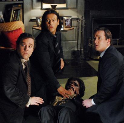 From left: Andy Nyman, Rupert Graves, and Matthew Macfadyen ambush Peter Dinklage, an American visitor, in 'Death at a Funeral.'