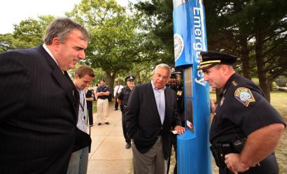 Mayor Menino spoke to a 911 dispatcher yesterday on an emergency phone in Franklin Park. With him were Police Commissioner Ed Davis (left) and Superintendent Dan Linskey.