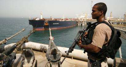 A US Navy sailor at the Al Basra Oil Terminal in August. Most of Iraqi oil bound for the world market is loaded onto tankers through the terminal's web of pipes and metal walkways.