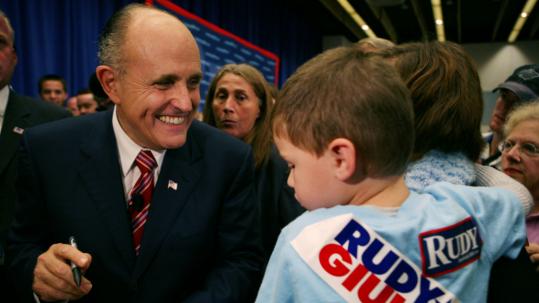 Republican presidential hopeful Rudy Giuliani greeted supporters after a town hall meeting at Drake University in Des Moines, Iowa. Rival Mitt Romney leads most polls in that state.