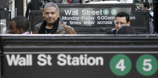 Commuters emerged from the subway near the New York Stock Exchange. Industry watchers say the oldest subways need serious upgrades but don't have enough money to keep up.