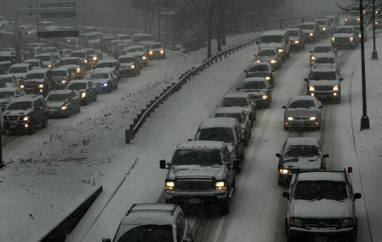 Traffic crawled on Storrow Drive last week as a midsized storm blanketed the region with snow.