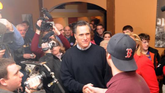 Mitt Romney, campaigning in New Hampshire on Sunday, finds himself in a two-front battle, targeting Mike Huckabee, then John McCain as each has emerged as threats.