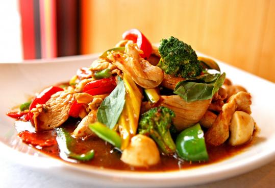 The crispy chicken Bangkok basil features chicken that is deep-fried, then stir fried with vegetables in a hot chili basil sauce.
