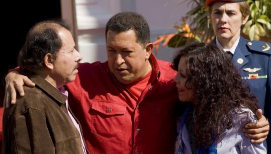 Hugo Chávez (center) welcomed President Daniel Ortega of Nicaragua and his wife, Rosario Murillo, to Caracas yesterday for the summit of the Bolivarian Alternative for the Nations of Our America. Leaders launched a new development bank at the summit.