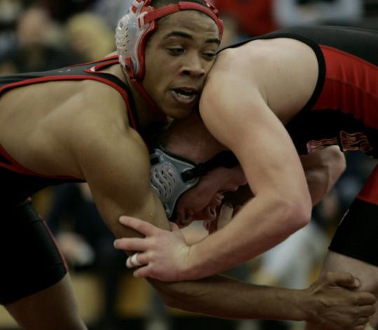Winchester's Mike Jumper (left) attempts to lock up North Andover's Derek Timpe in their 152-pound match, part of a quad meet that the undefeated Sachems swept.
