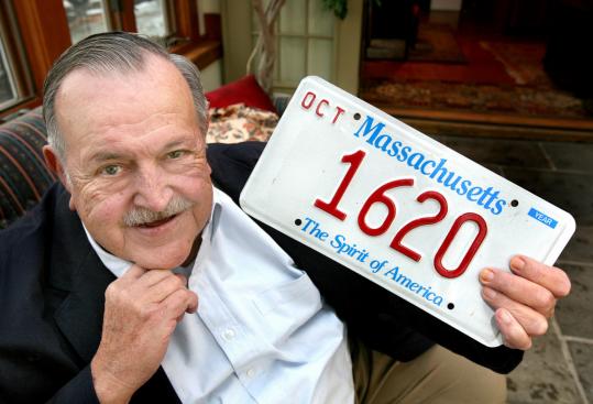 Dexter Olsson displays the license plate with the number that was originally given to his father almost 50 years ago.