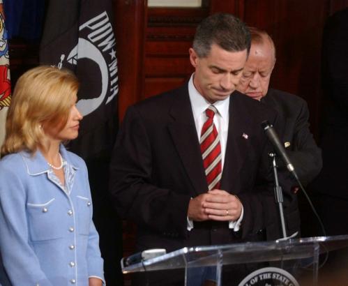 Gina Matos McGreevey (left) stood beside her husband, James E. McGreevey, as he announced plans to resign as governor of New Jersey on Aug. 12, 2004, after admitting he had an extramarital affair with another man.