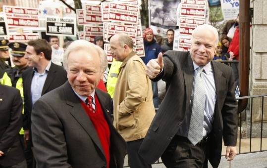 John McCain and Senator Joseph Lieberman (left) of Connecticut as they arrived yesterday in Exeter, N.H.