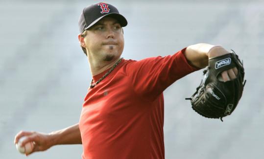 Red Sox ace Josh Beckett, who has been bothered by his back, threw from flat ground without pain yesterday and said, 'Everything's good. I did everything I wanted to do.'