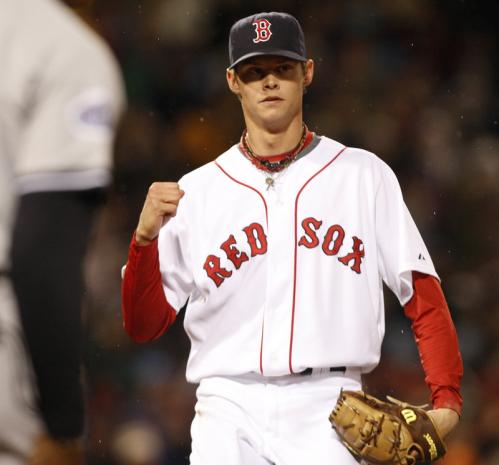 Red Sox pitcher Clay Buchholz pumped his fist after getting out of a fifth-inning jam after first baseman Sean Casey, not pictured, turned the unassisted double play to end the inning.