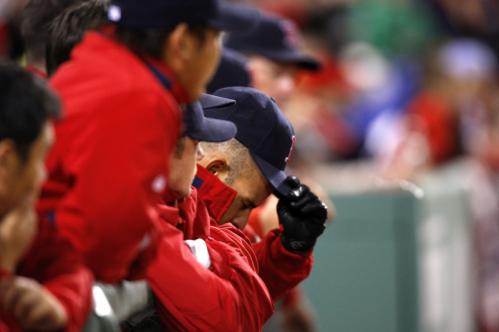 Red Sox players watched the last out in the ninth from the dugout.