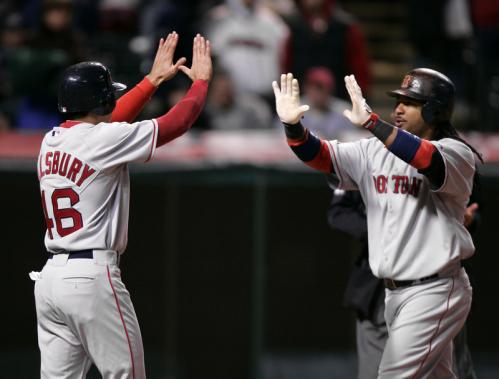 Manny Ramirez, right, is greeted by teammate Jacoby Ellsbury after Ramirez's two-run homer off Cleveland Indians relief pitcher Joe Borowski broke a tie in the ninth inning.