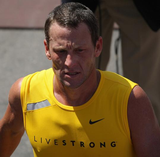 Lance Armstrong may have wished he had his bike once he hit the Marathon's treacherous hills, but he got over them and finished 496th.
