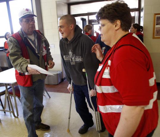 American Red Cross disaster team members and Massachusetts Maritime Academy cadets played the roles of rescuers and evacuees fleeing Cape Cod during an annual hurricane drill.