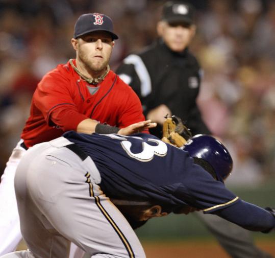 Dustin Pedroia finds it impossible to overlook Rickie Weeks to end the third.