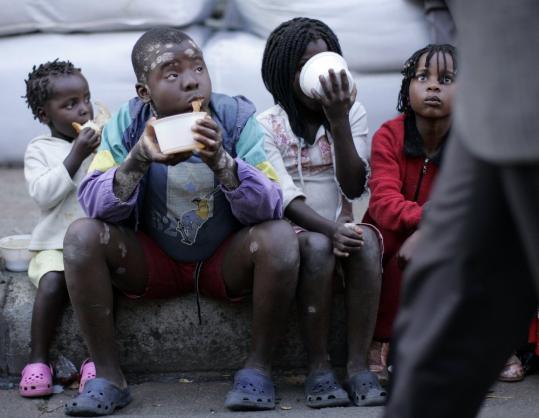 Children whose parents are immigrants to South Africa found a safe spot yesterday to eat soup and bread provided by a local Muslim community outside the city hall at Germiston, near Johannesburg.