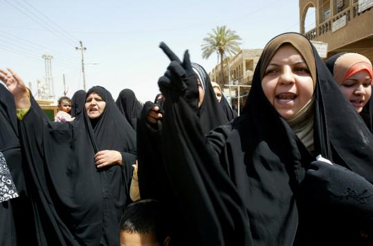 Iraqi women protested in Baghdad against the arrests of relatives by Iraqi and US military authorities. Dozens were detained in searches of two Shi'ite neighborhoods, witnesses said.