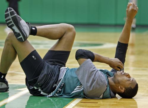 Celtics captain Paul Pierce stretches out on the floor at the conclusion of Monday's practice.