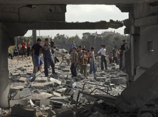 Palestinians viewed the destruction after an Israeli air strike yesterday in Beit Lahiya, in the Gaza Strip. The Israeli army said two armed men were killed in a different operation.