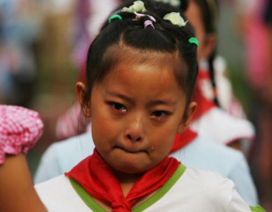 A student in Chengdu, Sichuan province, China, cried at a memorial ceremony last month.