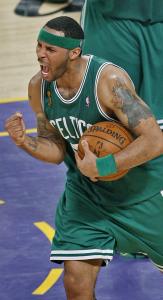 As the clock winds down, Eddie House celebrates a comeback win in which he scored 11 points.