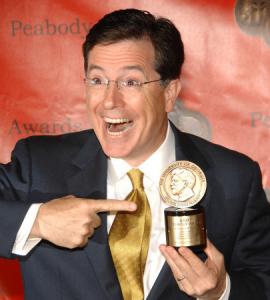 - Stephen Colbert poses yesterday with the Peabody Award received by his show, 'The Colbert Report.'