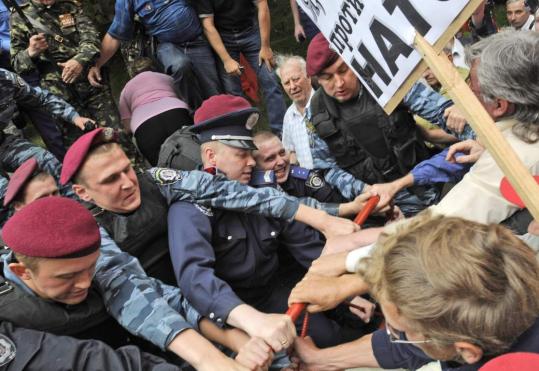 Leftists confronted the police as they marched during an anti-NATO protest yesterday in Kiev, where the NATO secretary general, Jaap de Hoop Scheffer, had come for a two-day visit.