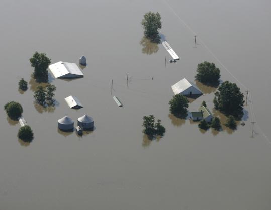 A farm was flooded by the Mississippi River after the Indian Grave Drainage District levee broke north of Quincy, Ill., and south of Meyer, Ill. At least 10 levees have been breached in Illinois and Missouri in recent days.