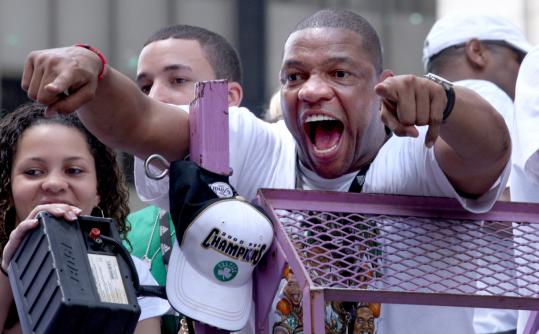 Celtics coach Glenn 'Doc' Rivers responded to the crowd during the team's rolling rally on Boylston Street.